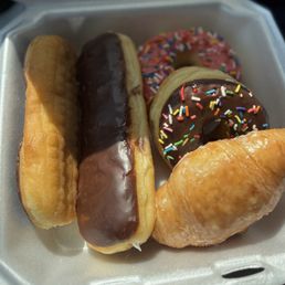 Creme-filled, croissant, strawberry and a chocolate sprinkled donut! Creme-filled, croissant, strawberry and a chocolate sprinkled donut!