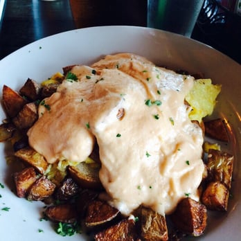 Engrained Brewing - Breakfast Horseshoe.  Beer cheese sauce on top of scrabbled eggs, sausage, and Texas toast. - Breweries Near Me - Springfield, Illinois