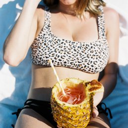 Cocktail served in a whole pineapple-- paper straw for the ocean3 Cocktail served in a whole pineapple-- paper straw for the ocean3
