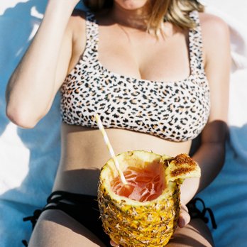 Swell - Cocktail served in a whole pineapple-- paper straw for the ocean3 - Beach Bars Near Me - Puerto Vallarta, JAL Swell - Cocktail served in a whole pineapple-- paper straw for the ocean3 - Beach Bars Near Me - Puerto Vallarta, JAL