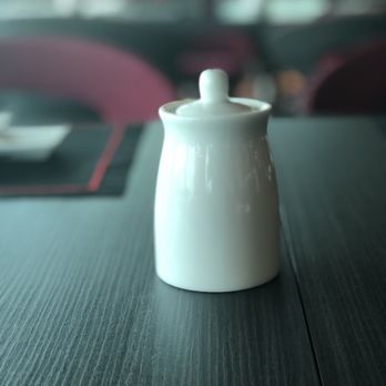 Izumi - a white tea pot on a table - Japanese Near Me - Fort Lauderdale, Florida Izumi - a white tea pot on a table - Japanese Near Me - Fort Lauderdale, Florida