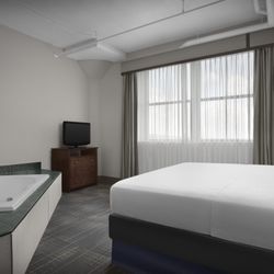 The Suites Hotel at Waterfront Plaza - Relax in our renovated Whirlpool King Suites.
