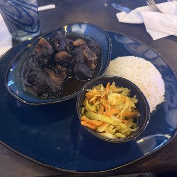 Kingston Grill - Oxtails with white rice and cabbage - Caribbean Near Me - Forest Park, Georgia Kingston Grill - Oxtails with white rice and cabbage - Caribbean Near Me - Forest Park, Georgia