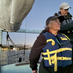 Capt Dan Classic Sails - Me at the helm under watchfull eyes of Captain Dan.  So much FUN!