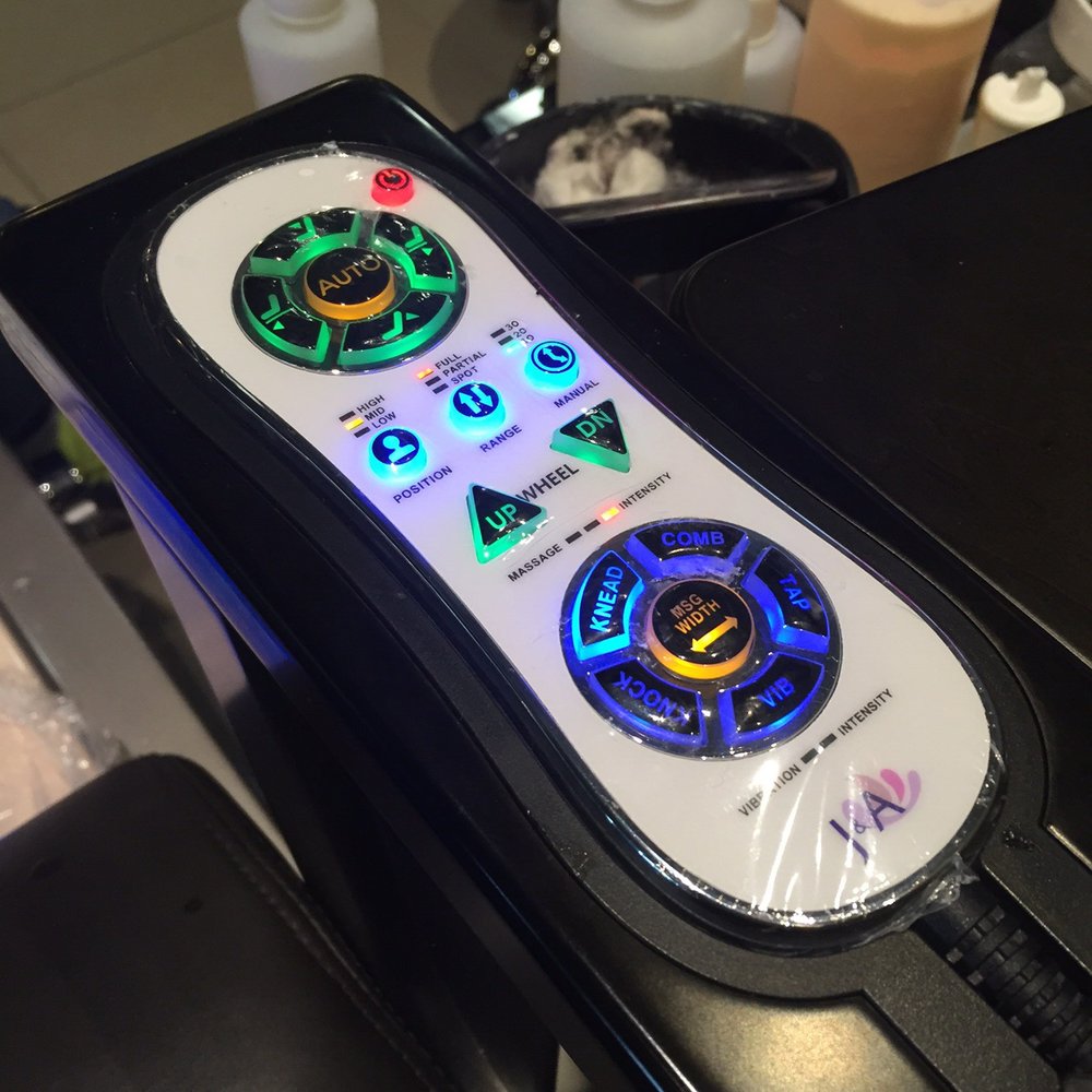 In armrest remote. Very clean and easy to figure out.