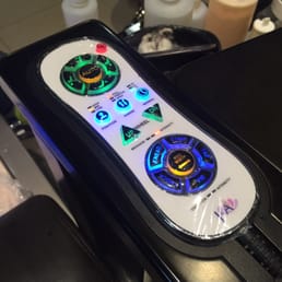In armrest remote. Very clean and easy to figure out.