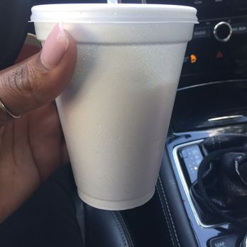 Dan's Vitamin House - a hand holding a plastic cup - Vitamins & Supplements Near Me - Houston, Texas