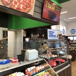 Pizza and other hot foods are made fresh in this area.