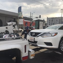 Hertz Rent A Car - The AAA tow truck towing the dead car