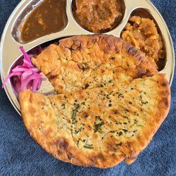 Ustaad G76 - Amritsari kulchas (Mixed veg + Kheema), Mutton Curry, Chutney and Moong Daal Halwa, plated at home in a traditional Indian thali