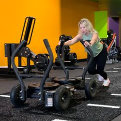 Exygon Health & Fitness Club - EX02 Lab features an artificial turf track for sled workouts.