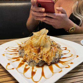 Sushi Yama - a woman taking a picture of her food - Sushi Bars Near Me - West Palm Beach, Florida Sushi Yama - a woman taking a picture of her food - Sushi Bars Near Me - West Palm Beach, Florida