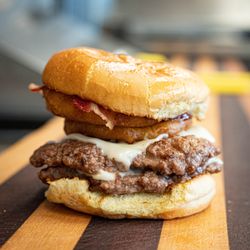 Riccotti's Sandwich Shop - House made beef patties with bbq sauce, bacon, onion rings