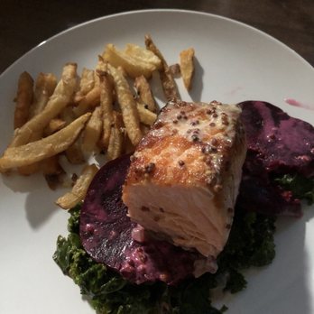 Zona Sur Bar Bistro - Pan-Seared Salmon over beets and kale with herbed fries (for delivery). Better than kickin up the stove in this heat wave for sure! - New American Near Me - Brooklyn, New York Zona Sur Bar Bistro - Pan-Seared Salmon over beets and kale with herbed fries (for delivery). Better than kickin up the stove in this heat wave for sure! - New American Near Me - Brooklyn, New York