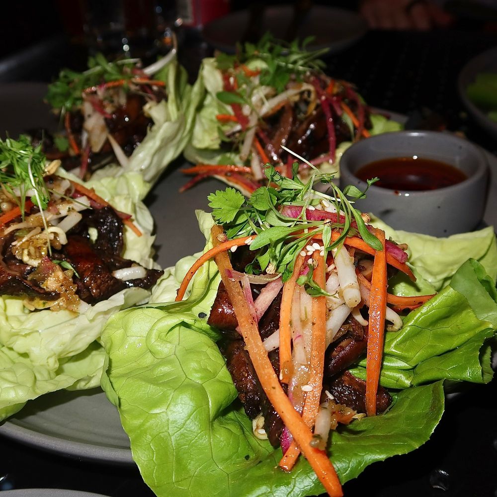 American Elm - The Portobello Wraps were made with bulgogi marinade, grilled portobello, bibb lettuce, carrot, sprouts, radish, cilantro, & toasted garlic - New American Near Me - Denver, Colorado American Elm - The Portobello Wraps were made with bulgogi marinade, grilled portobello, bibb lettuce, carrot, sprouts, radish, cilantro, & toasted garlic - New American Near Me - Denver, Colorado