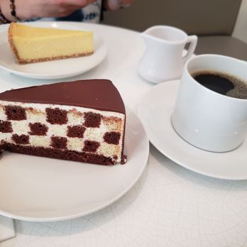 Waikiki Tea - Passion fruit cheesecake (top), Checkers cake (bottom), Kona Coffee ($4.00). - Desserts Near Me - Honolulu, Hawaii Waikiki Tea - Passion fruit cheesecake (top), Checkers cake (bottom), Kona Coffee ($4.00). - Desserts Near Me - Honolulu, Hawaii