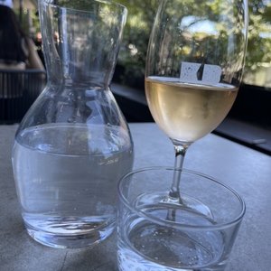 Photo of The Kettle Black - South Melbourne Victoria, Australia. Rose wine and sparkling water on the patio