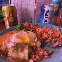 Beef enchiladas with an egg on top, rice and beans. Delicious. Beef enchiladas with an egg on top, rice and beans. Delicious.
