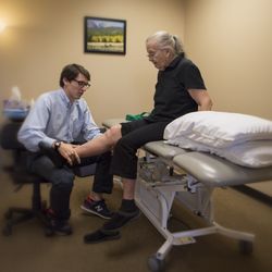 Pro Active Physical Therapy and Sports Medicine - Physical Therapist Reed Brandenburg helping a patient recover from knee pain.