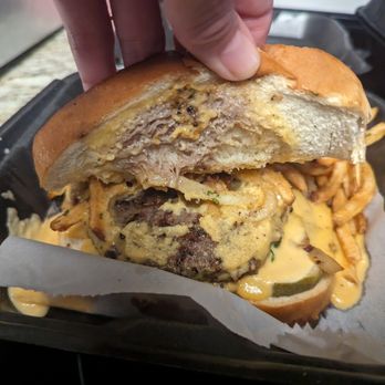 Old Black Bear Brewing Company- Athens - This may be the American Dream burger. It has a lot of caramelized onions, and some pickles. It's salty. - New American Near Me - Athens, Alabama Old Black Bear Brewing Company- Athens - This may be the American Dream burger. It has a lot of caramelized onions, and some pickles. It's salty. - New American Near Me - Athens, Alabama