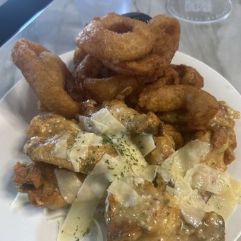 Something Special Bar & Lounge - Garlic Parmesan Wings w/ Onion Rings - Cocktail Bars Near Me - Conyers, Georgia Something Special Bar & Lounge - Garlic Parmesan Wings w/ Onion Rings - Cocktail Bars Near Me - Conyers, Georgia