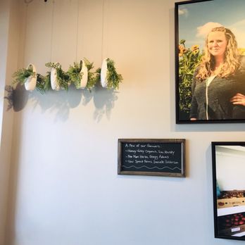 Mountain Juicery - a picture of a woman hanging from the ceiling - Juice Bars & Smoothies Near Me - Asheville, North Carolina