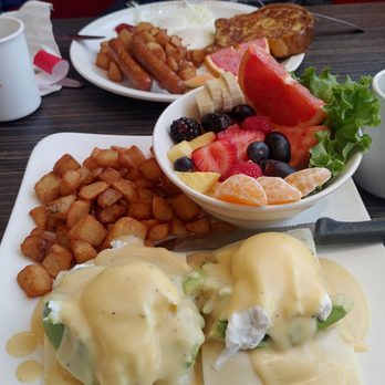 Allo Mon Coco - French toast with egg and sausage (back) and avocado Swiss cheese Eggs Benedict with fresh fruit (front) - Breakfast & Brunch Near Me - Ottawa, Ontario