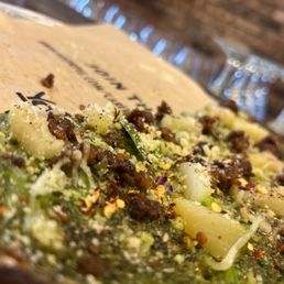 a close up view of a pizza a close up view of a pizza