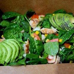 Yeshi's Juice & Mart - Grilled chicken with spinach, corn, tomatoes, cucumbers, with avocado topping.