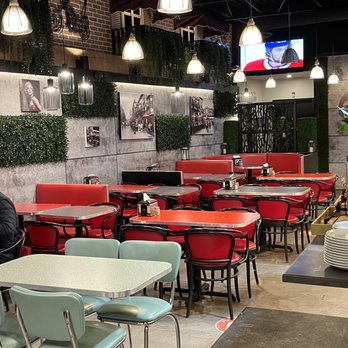 Gazebo Burger & Grill - tables and chairs in a restaurant - Burgers Near Me - Mississauga, Ontario Gazebo Burger & Grill - tables and chairs in a restaurant - Burgers Near Me - Mississauga, Ontario