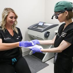 Idaho Dermatology Mohs Collective - Our mohs tech preparing tissue for Dr. Layher to review under the microscope.