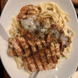 The Queensland chicken and shrimp pasta which is fettuccine tossed in Alfredo sauce. The Queensland chicken and shrimp pasta which is fettuccine tossed in Alfredo sauce.
