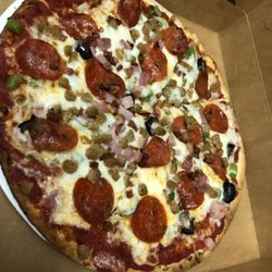 Pizza with everything on it! (Sausage, pepperoni, ham, bacon, green peppers, onions, mushrooms, and black olives)