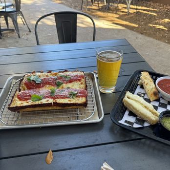 Thunderbird Pies - Cheese pizza, beer and half eaten cheeses bread - Pizza Near Me - Dallas, Texas Thunderbird Pies - Cheese pizza, beer and half eaten cheeses bread - Pizza Near Me - Dallas, Texas