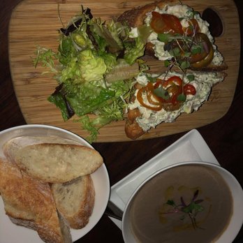Amelie - $17 crab tartine, complementary bread, and the creamy mushroom soup $10, which packed so much flavor it's difficult to describe. - French Near Me - New York, New York