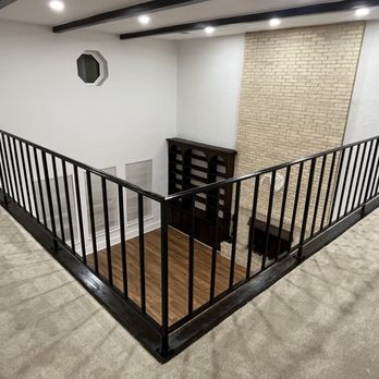 Palacios Construction Group - Home remodel in Spring, TX: Custom black metal railing, modern design, enhancing safety and style in this renovated open loft space. - General Contractors Near Me Palacios Construction Group - Home remodel in Spring, TX: Custom black metal railing, modern design, enhancing safety and style in this renovated open loft space. - General Contractors Near Me