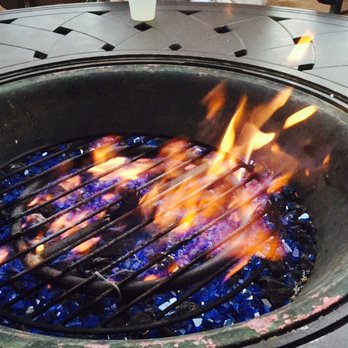 Pacific Terrace Hotel - By the pool, your heated table. And here come the s'mores - San Diego, CA