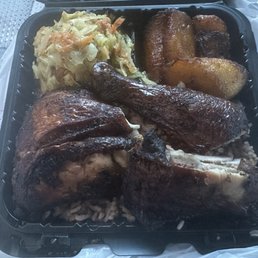 Jerk Chicken Dinner (no gravy) with rice and peas, steam cabbage, and plantains.
