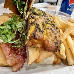 Crispy Apple Jack Chicken Sandwich - apple butter spread, pepper jack cheese, arugula on a toasted herb focaccia.