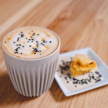 Simona Cafe - Honey-Sesame Cappuccino: Oat Milk, Honey-Tahini Sauce, Espresso & house-made Honeycomb-Candy bits, topped with Black Sesame. - Coffee & Tea Near Me - Arlington, Virginia Simona Cafe - Honey-Sesame Cappuccino: Oat Milk, Honey-Tahini Sauce, Espresso & house-made Honeycomb-Candy bits, topped with Black Sesame. - Coffee & Tea Near Me - Arlington, Virginia