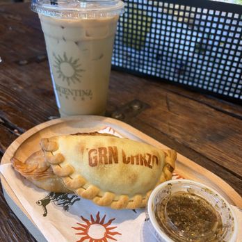Argentina Bakery - BBQ brisket and green chorizo empanadas with chimichurri sauce. Iced vanilla latte. - Bakeries Near Me - Irving, Texas