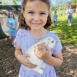 The Flower Meadow - After Story Time in The Barnyard we allow kids to hold baby animals whenever we have them available.