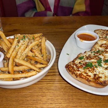 Giordano's - Parmesan cheese fries and cheese bread stick. Both are appetizers. A side of ketchup for the fries and marina sauce for the cheesy sticks . - Pizza Near Me - Chicago, Illinois