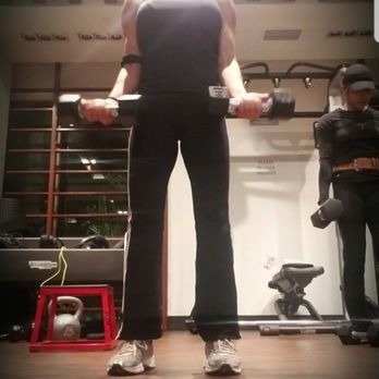 Bell South Bay Apartments - There is a separate glass room available with a large screen  offering various exercise routines to select from. - Apartments Near Me - Inglewood, California