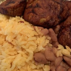 Primo Deli - Yellow rice and beans topped with plantain slices. (Sometimes plantain served undercooked)