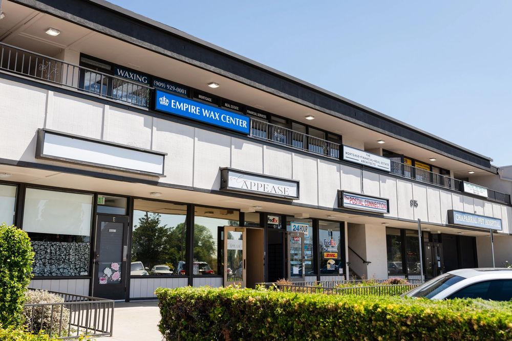 Empire Wax Center Logo