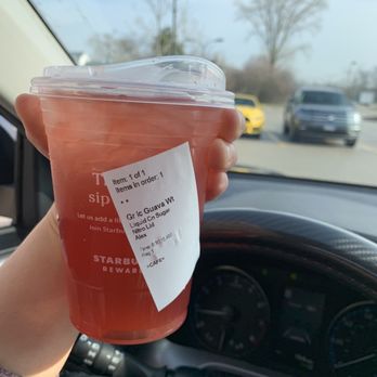 Starbucks - a hand holding a cup of iced tea - Coffee & Tea Near Me - Northbrook, Illinois