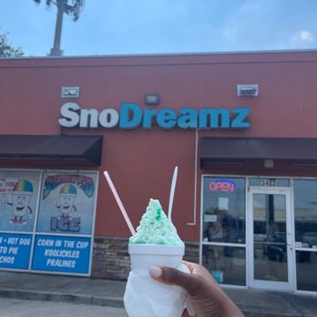 Sno Dreamz - a hand holding a cup of ice cream - Shaved Ice Near Me - Houston, Texas Sno Dreamz - a hand holding a cup of ice cream - Shaved Ice Near Me - Houston, Texas