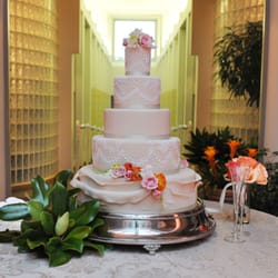 Jan Kish - La Petite Fleur - Towering Wedding Cake with intricate detail