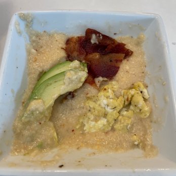 Juniper Market - Grits that aren't seasoned, one egg, half an avocado and bacon. You could do this yourself easily. - Coffee & Tea Near Me - Saint Augustine, Florida Juniper Market - Grits that aren't seasoned, one egg, half an avocado and bacon. You could do this yourself easily. - Coffee & Tea Near Me - Saint Augustine, Florida